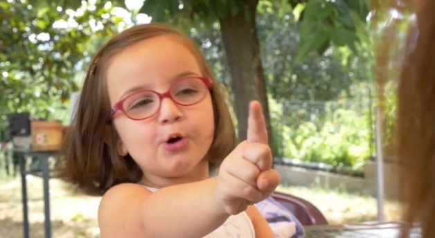 Five year old girl pointing finger