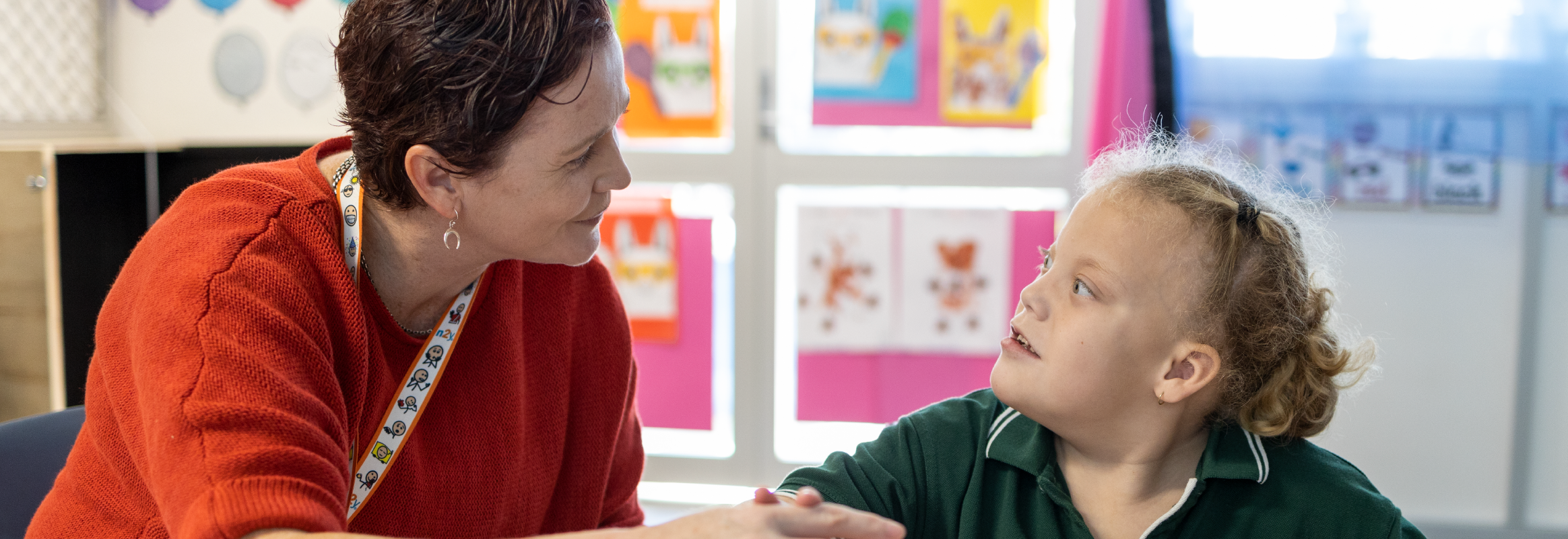Communication partner speaking with an AAC user