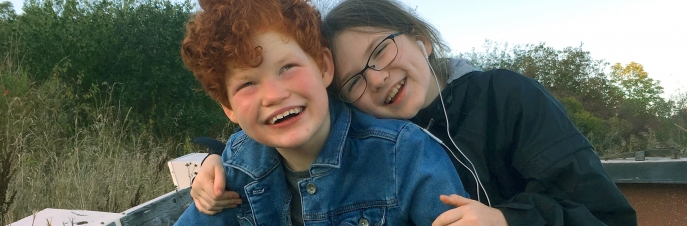 Two girls hugging and smiling