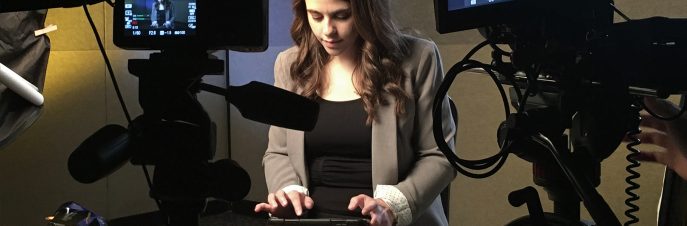 Girl typing on an iPad