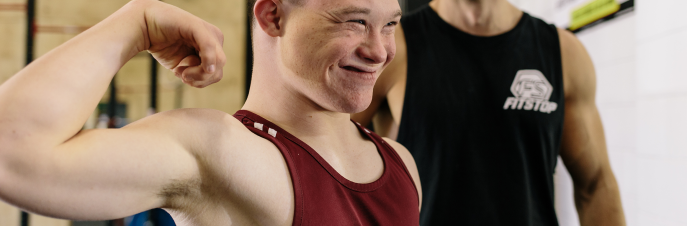 Boy showing off his arm muscle