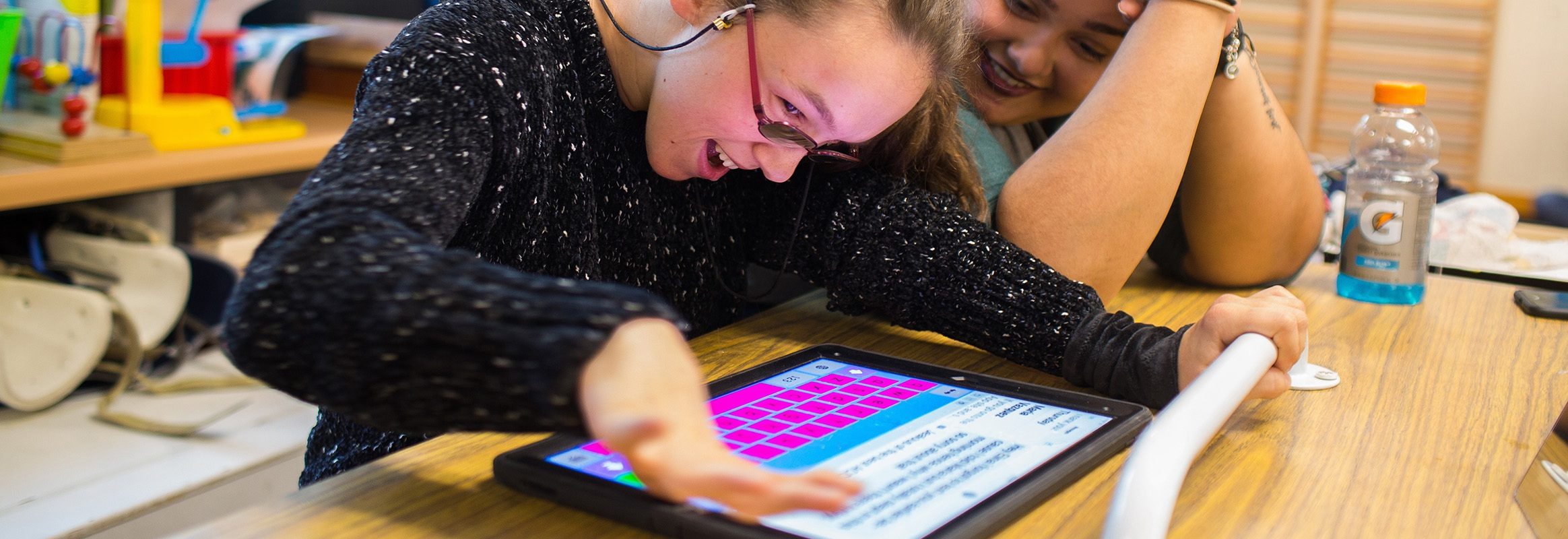 Girl using Keeble iPad keyboard in classroom