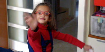 Emily waving at the camera