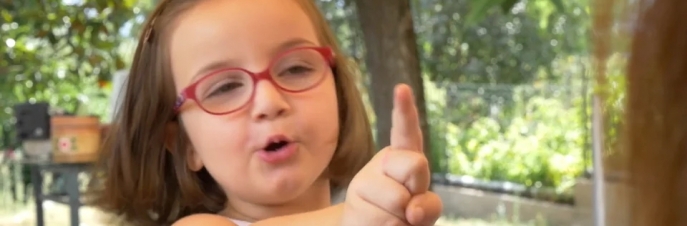 Five year old girl pointing finger