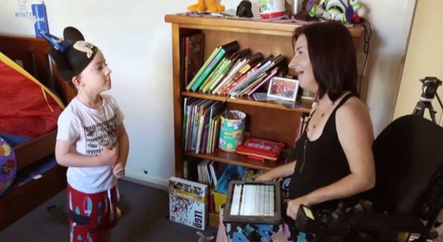 Lisa talking to Hunter who wears a Micky Mouse hat