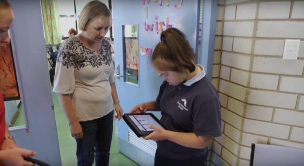 Danica using Proloquo2Go to talk to teacher