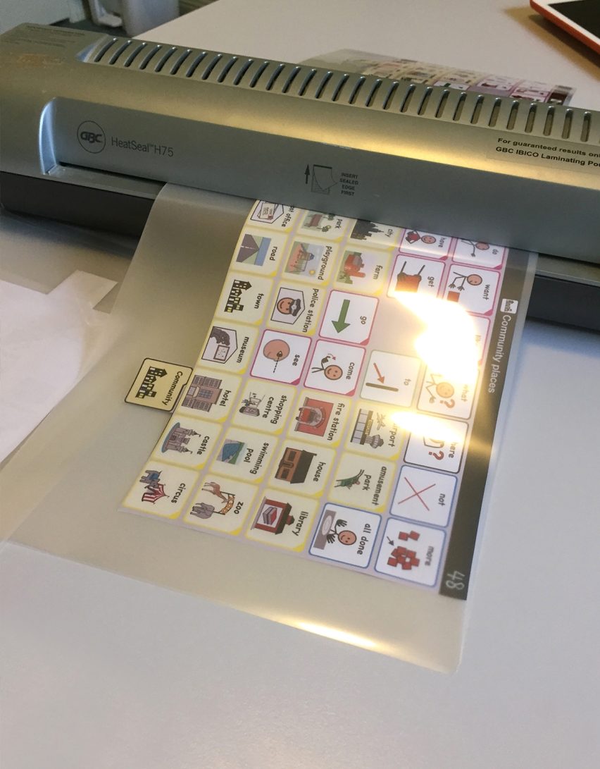 Laminating page AAC book