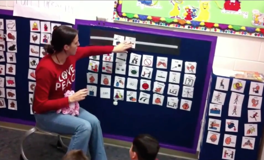 Teacher using paper based Core Word board in class