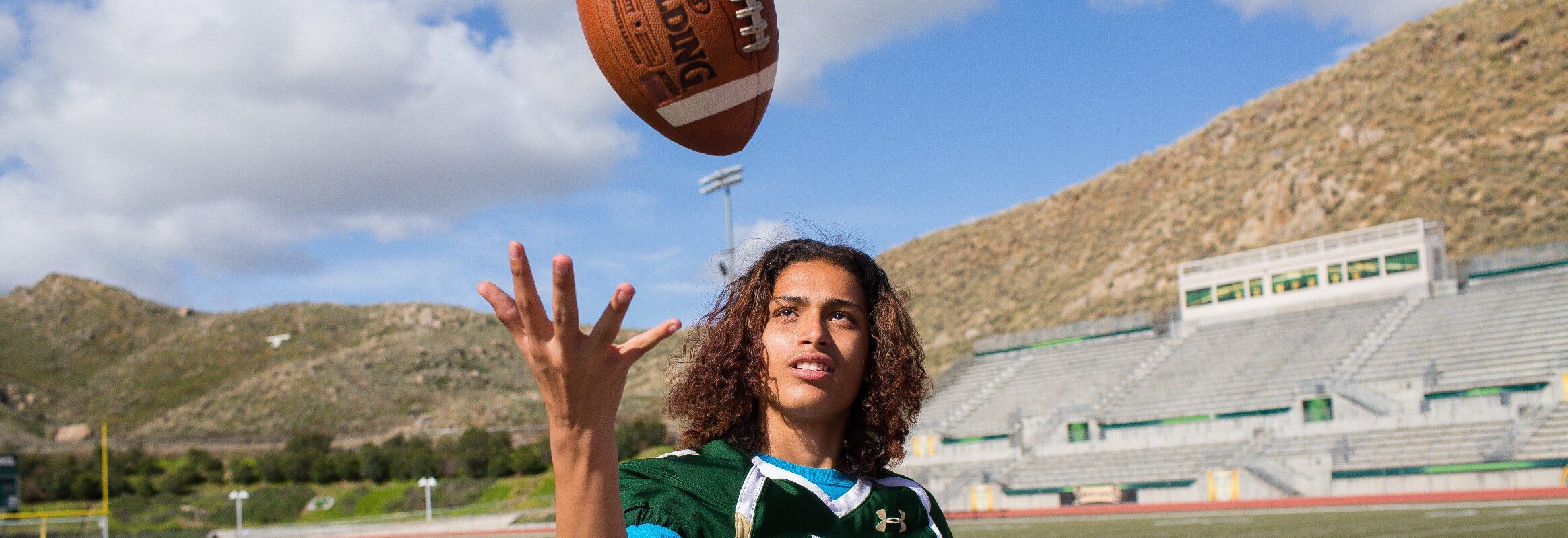 Teen boy playing football