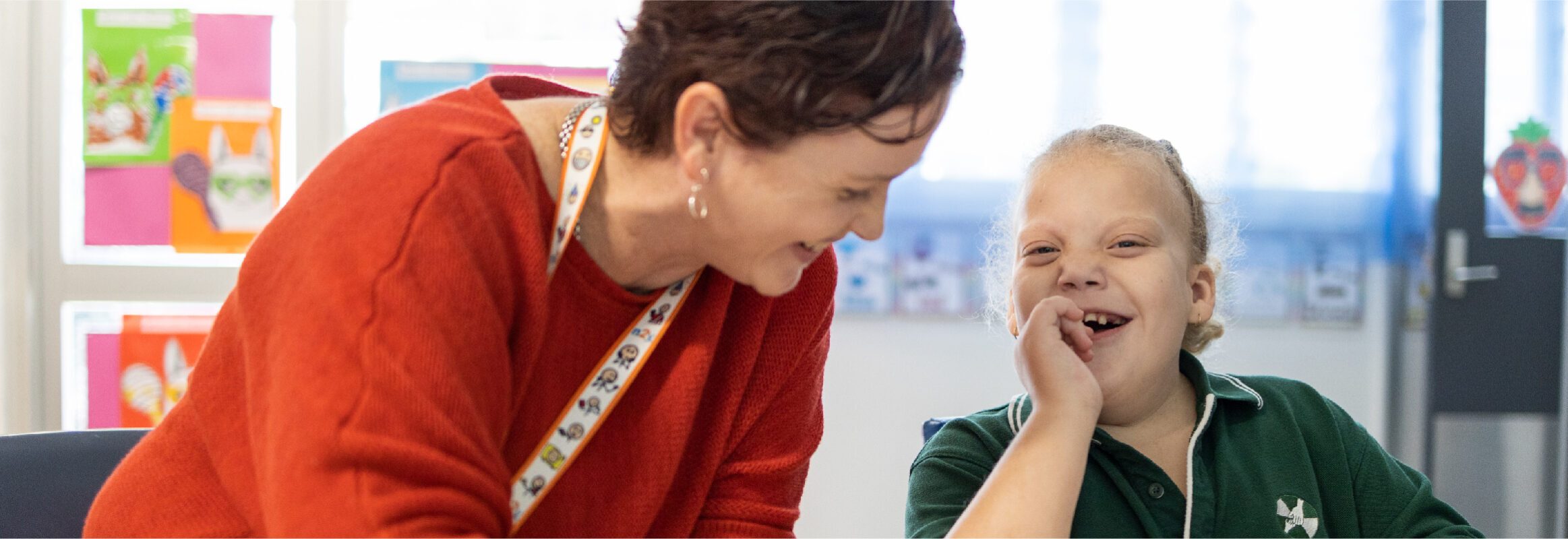 Amanda and student having fun in the classroom