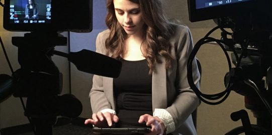 Girl typing on an iPad