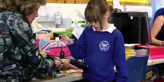 Ruby talking to teacher with iPad