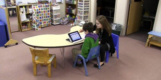 Max and teacher in classroom