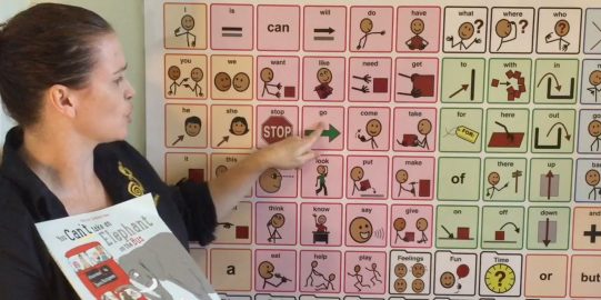 Teacher pointing to picture word chart