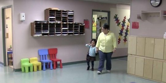 Vanessa walking with mom in school